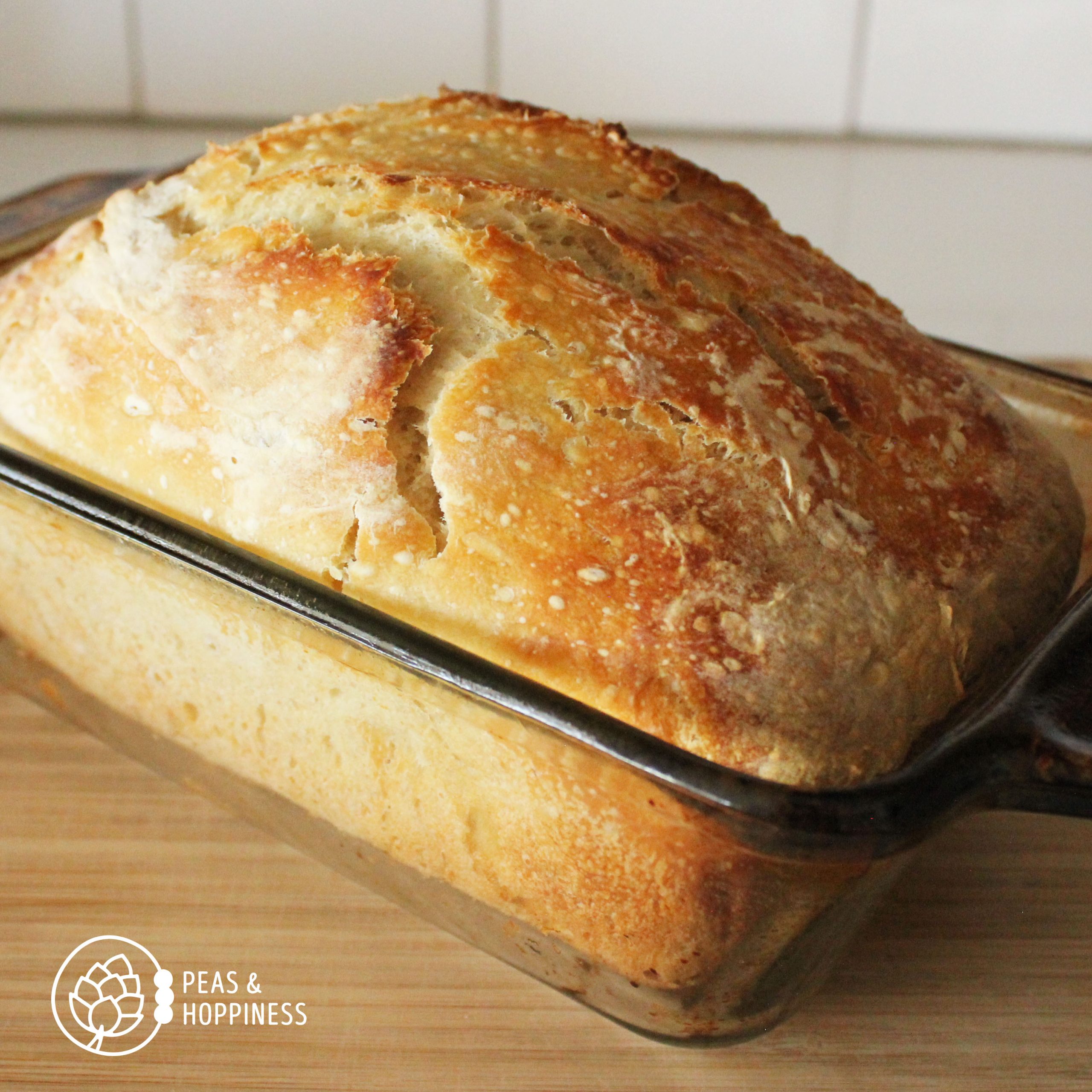 Fresh sourdough bread still in baking pan