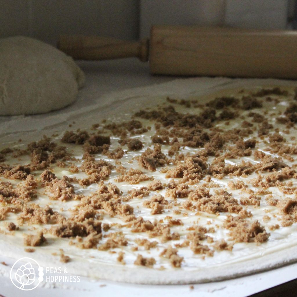 Spread ingredients evenly across rolled dough