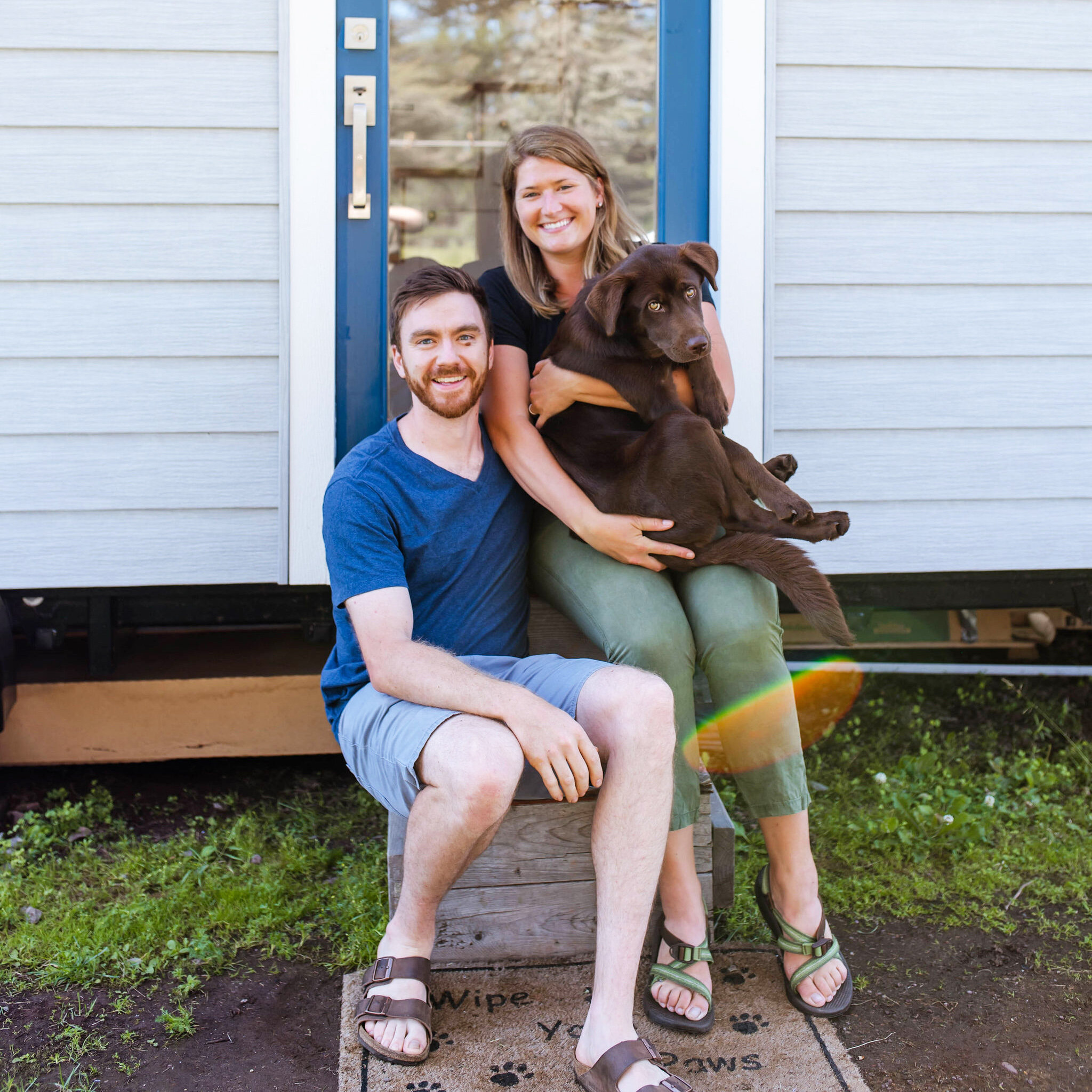 Sophie and Henry with their dog Cora in their Tiny Home outside of Duluth, MN. Photo cred: Sydney Carlino