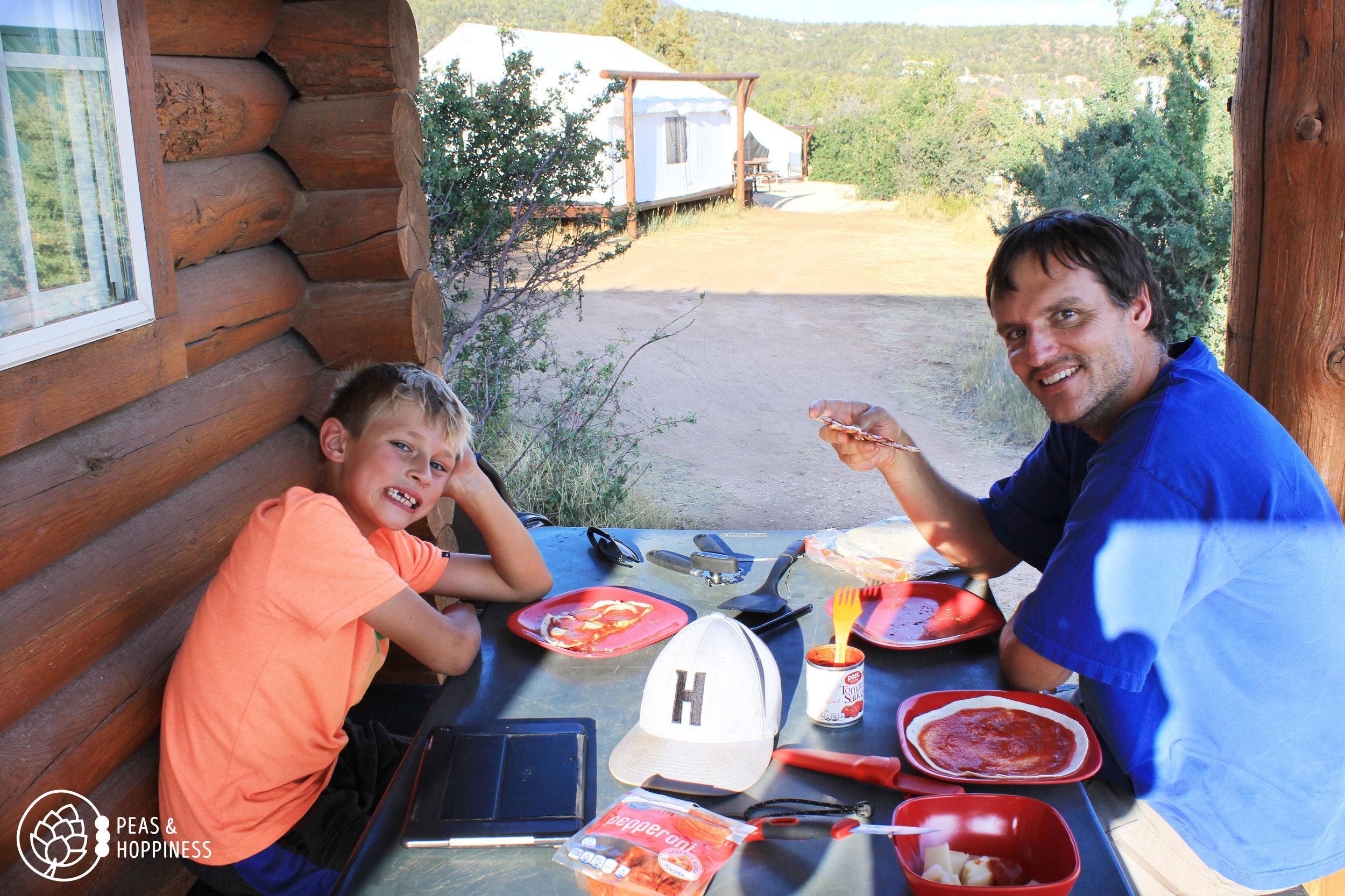 Back in "civilization" at our cabin near Zion, eating tortilla pizzas cooked over the fire. They are as tired as they look!