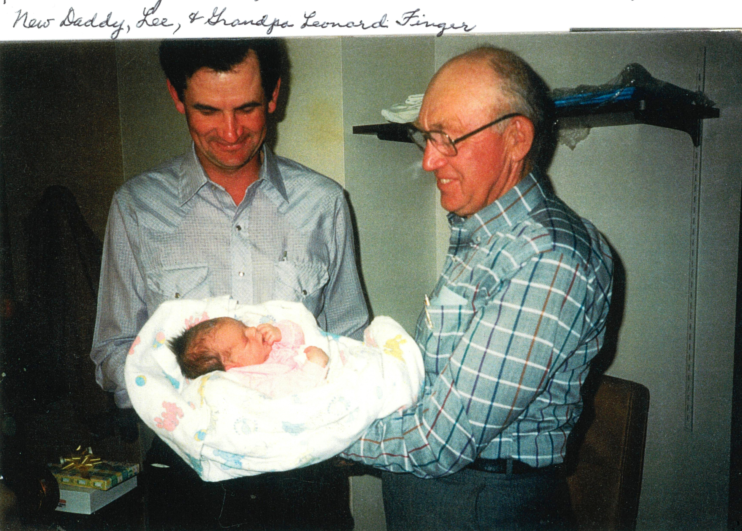 Baby Ann with daddy Lee and Grandpa Finger