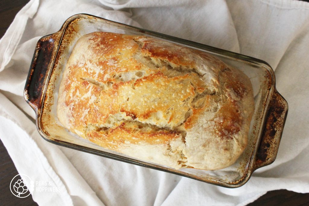 Fresh Sourdough Bread still in the glass loaf pan
