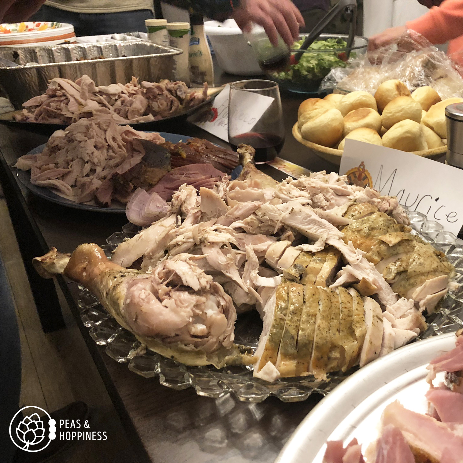 Table of food at Thanksgiving - Turkey, rolls, and more